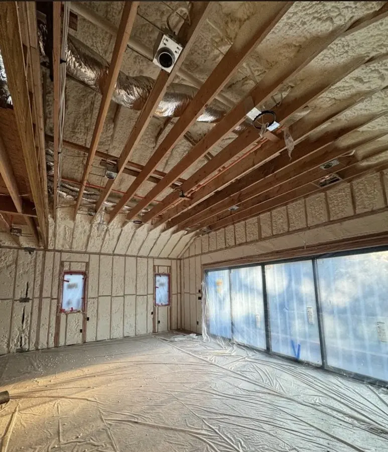 Interior walls and ceiling insulated with spray foam during new construction in San Mateo